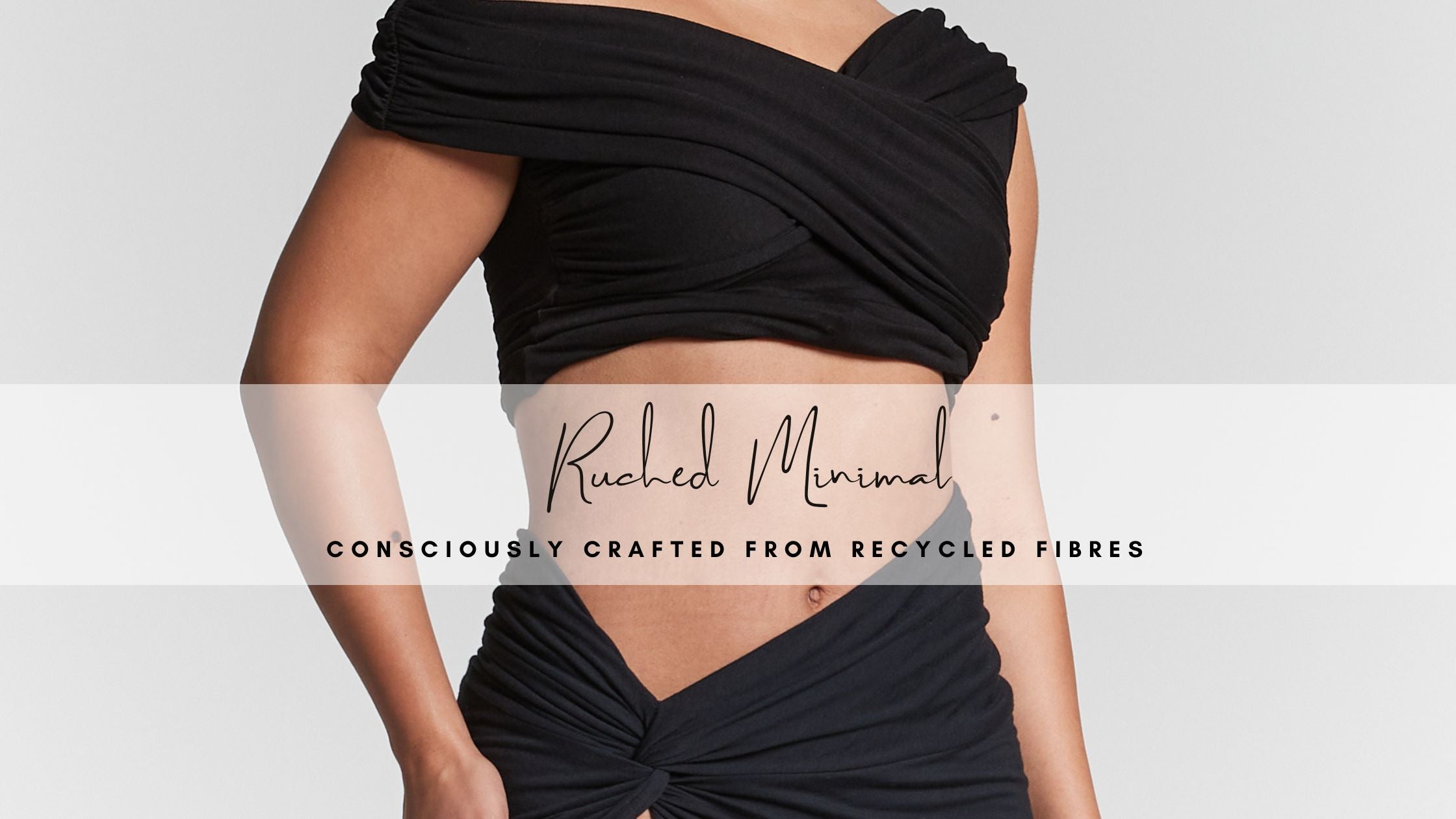 Black ruched Bardot crop top with off-the-shoulder neckline paired with a black pleated bodycon skirt. The crop top features a fitted, textured design with off-the-shoulder sleeves, while the skirt hugs the body with a sleek, pleated texture. Black Pleated top made from organic cotton